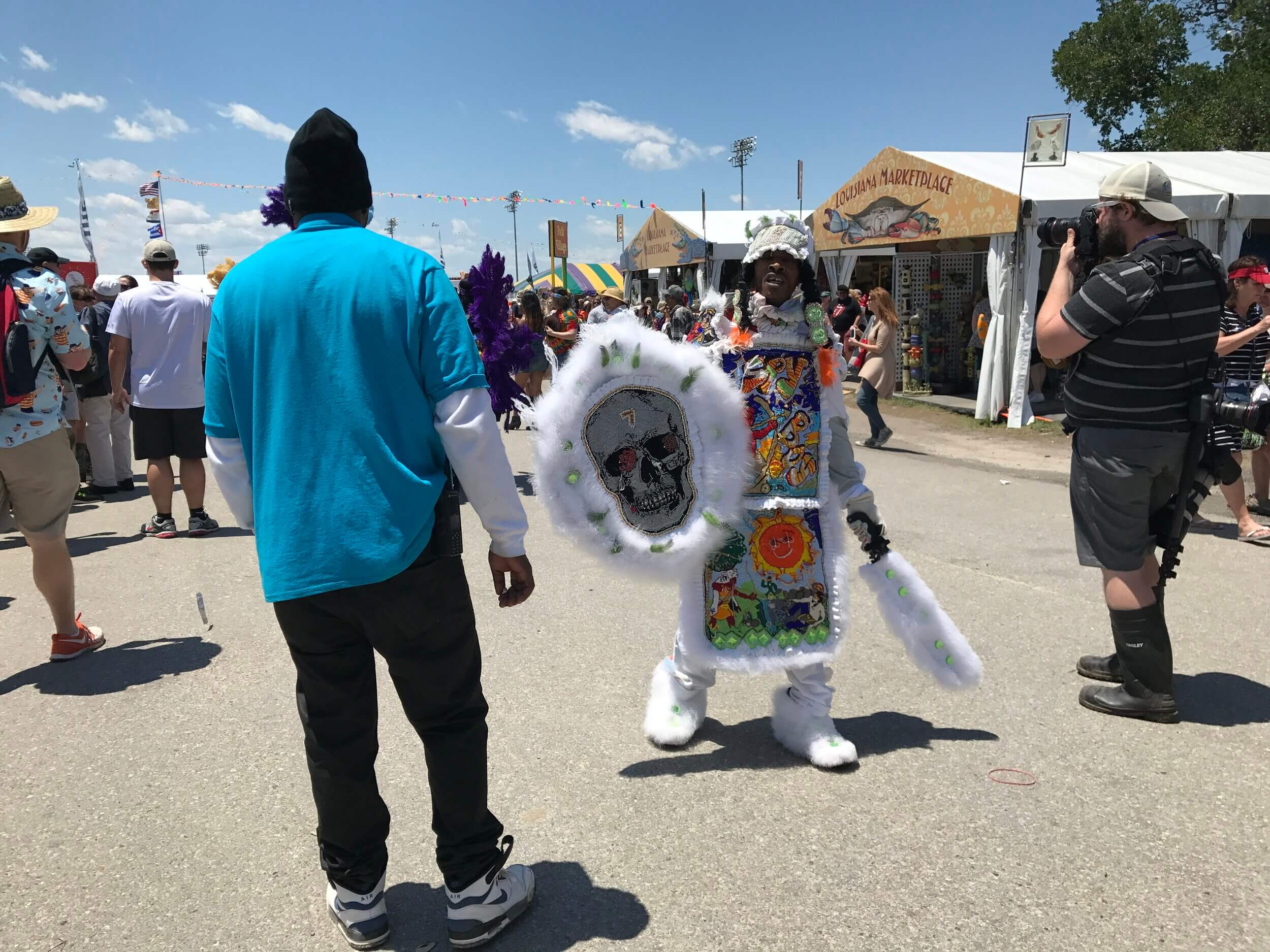 Mardi Gras Indians roam the grounds at the New Orleans Jazz &amp; Heritage Festival.