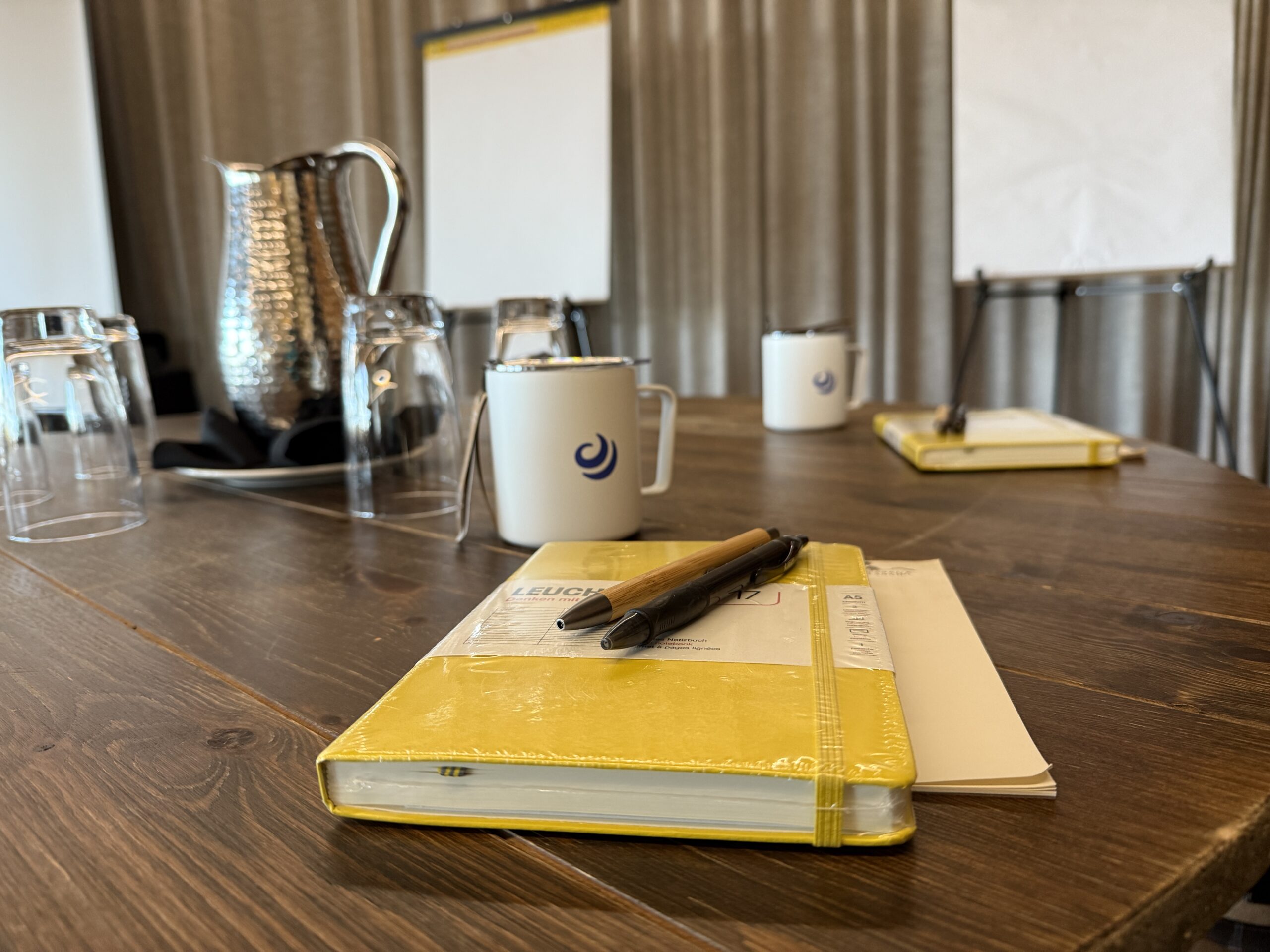 A live band performing at a high-energy corporate event, highlighting the production quality provided by a professional corporate event planner.